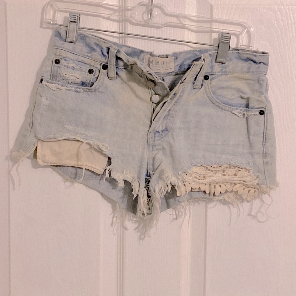 We The Free size 24” waist, distressed jean shorts, EUC. From a smoke/pet free